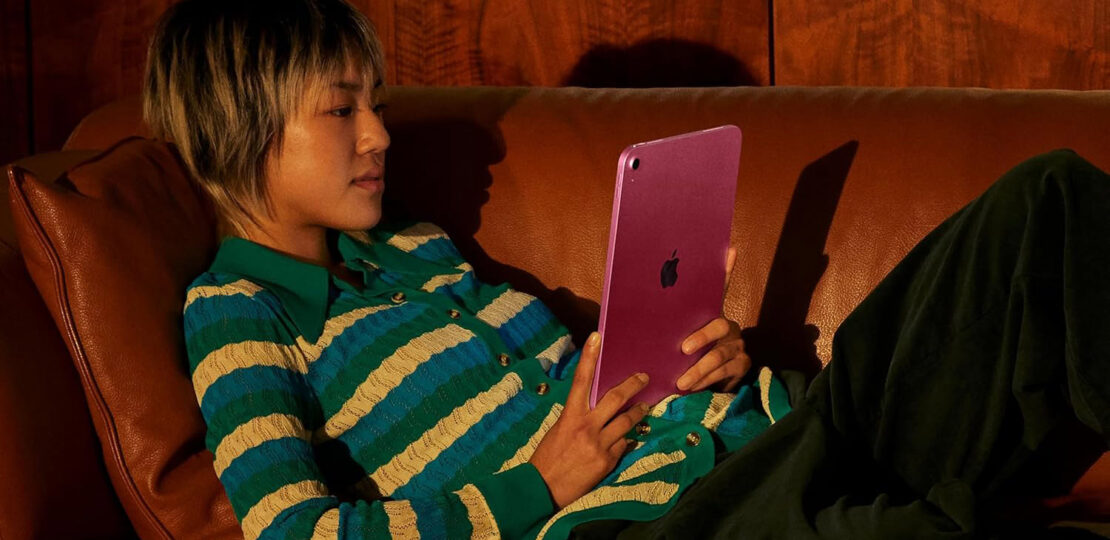 Apple-iPad-A16-being-used-by-lady-on-couch.jpg