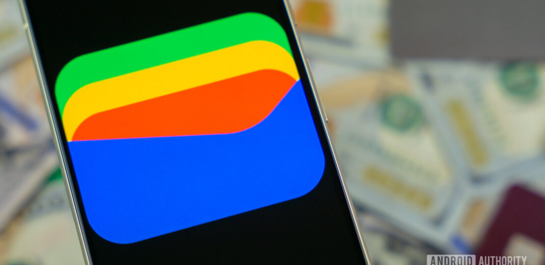 Google-Wallet-logo-on-smartphone-next-to-credit-cards-and-cash-Stock-photo-12.jpg