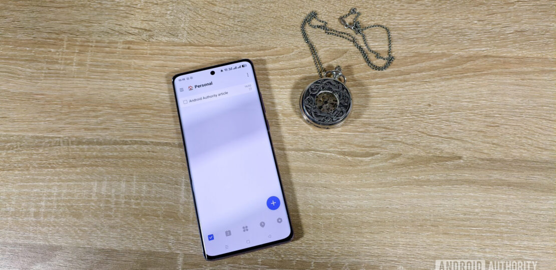 a-task-in-the-ticktick-app-on-a-smartphone-next-to-a-pocket-watch-scaled.jpg