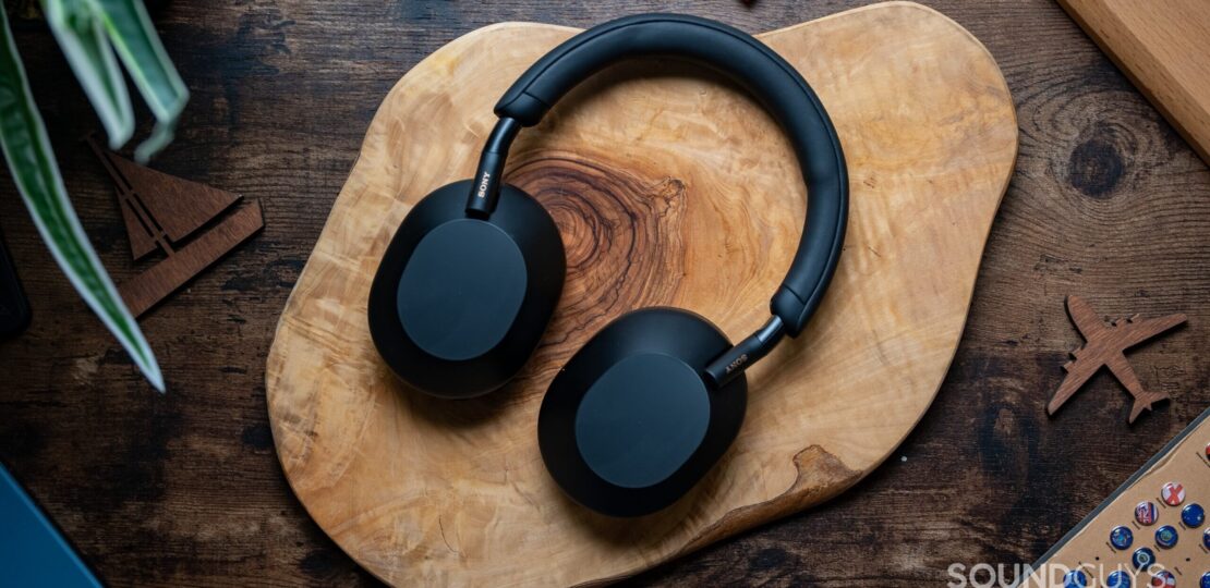 Sony-WH-1000XM5-headphones-laying-flat-on-wooden-table.jpg