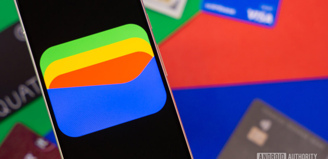 Google-Wallet-logo-on-smartphone-next-to-credit-cards-and-cash-Stock-photo-3.jpg